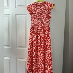 NWT  Smocked Dress with side slit in beautiful floral pattern.